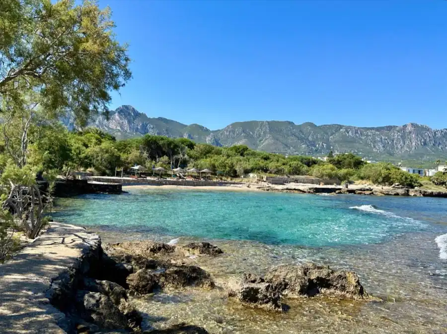 Riviera Beach with clear water and mountain views